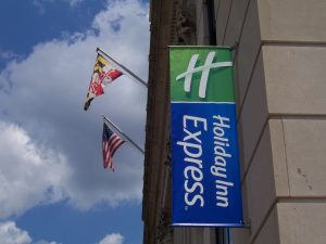 Flag Signs hanging exterior storefront 3 300x225